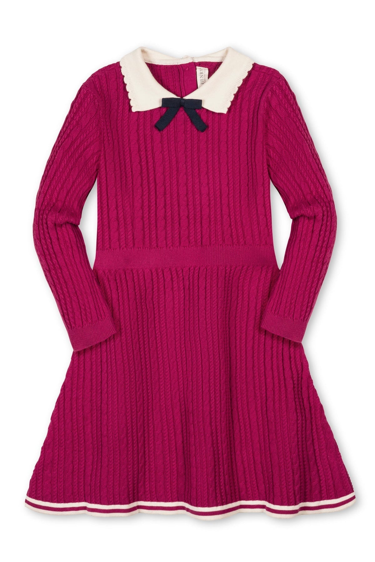 A vibrant fuchsia sweater dress features a cable knit design, scalloped white collar, and decorative navy bow. Made from organic cotton, it’s ideal for toddlers and girls special occasions.