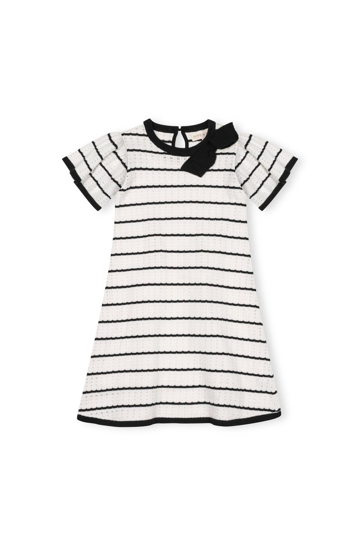 A short-sleeve A-line sweater dress in black and white features a pointelle design and a sweet bow detail at the neckline.