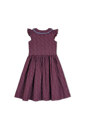 A wine-colored linen dress features a floral pattern, flutter sleeves, and a crochet-trimmed Peter Pan collar. This fully lined, organic cotton dress is perfect for toddlers and young girls.