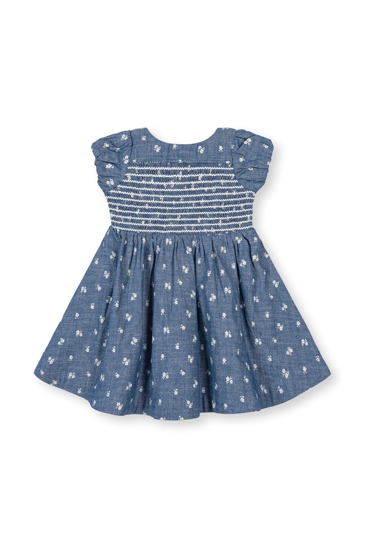 A soft blue chambray baby dress features a smocked bodice and delicate floral embroidery. Crafted from 100% organic cotton, this dress is perfect for special occasions and everyday wear.