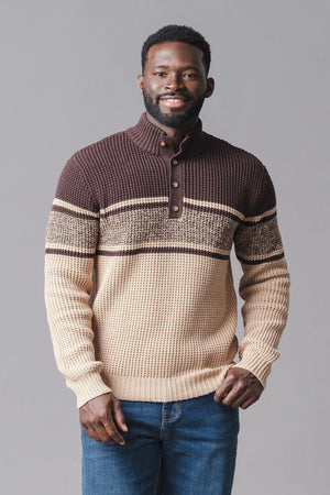 A smiling man wears a cozy, organic cotton mock neck waffle sweater featuring a striped pattern in brown and beige.
