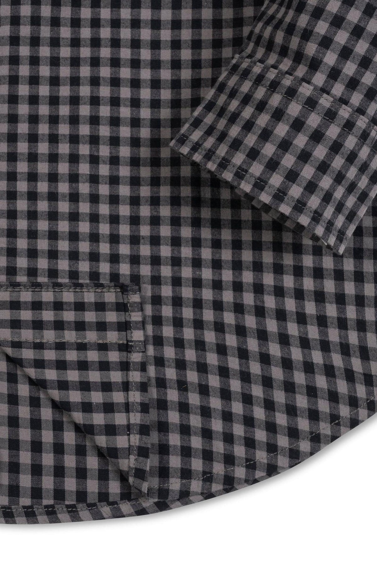Close-up view of a black gingham organic cotton stretch poplin shirt, featuring a button-down front, a functional chest pocket, and a curved hem, perfect for kids ages 2T-18.