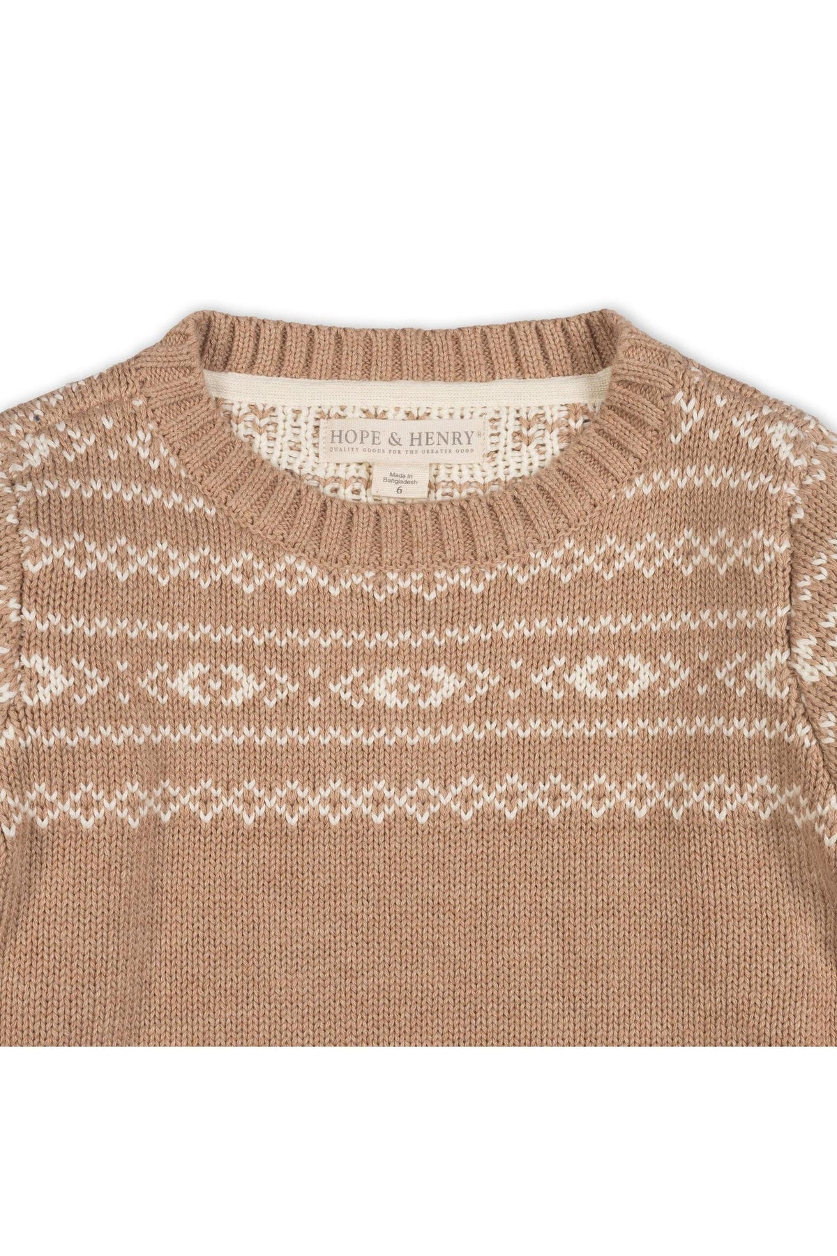 Close-up of a camel-colored organic cotton sweater featuring a Fair Isle design in cream. The crew neck pullover is made by Hope & Henry, highlighting its eco-friendly attributes.