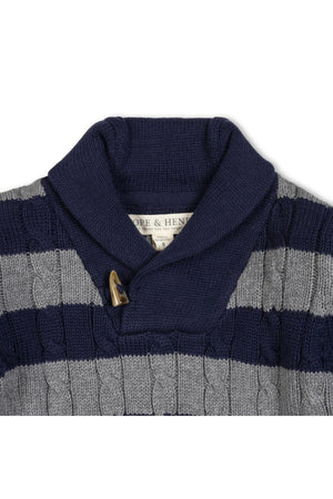 A cozy shawl collar sweater in navy and gray stripes, made from soft organic cotton, featuring a faux horn toggle closure. Perfect for stylish comfort in sizes 2T-18.
