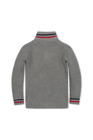 Back view of a dark gray organic cotton half-zip sweater featuring ribbed cuffs with red and navy stripes. Ideal for layering, this sustainable piece is suitable for kids aged 2T-18.