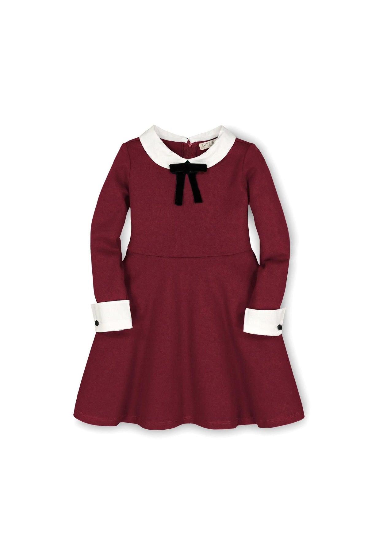 A classic oxblood dress featuring a contrast Peter Pan collar and cuffs, embellished with a black bow at the neckline.