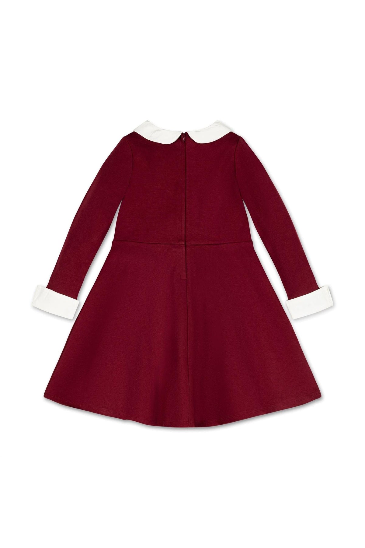 A back view of a toddler and girls dress in oxblood, featuring long sleeves, a white Peter Pan collar, and cuffs. The dress is made from comfortable ponte knit fabric.