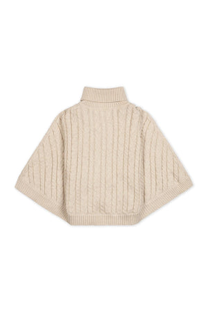 Light oatmeal organic cotton turtleneck sweater cape featuring a cozy rib knit design and an allover cable pattern. Ideal for toddlers and girls, this stylish piece offers warmth and comfort.