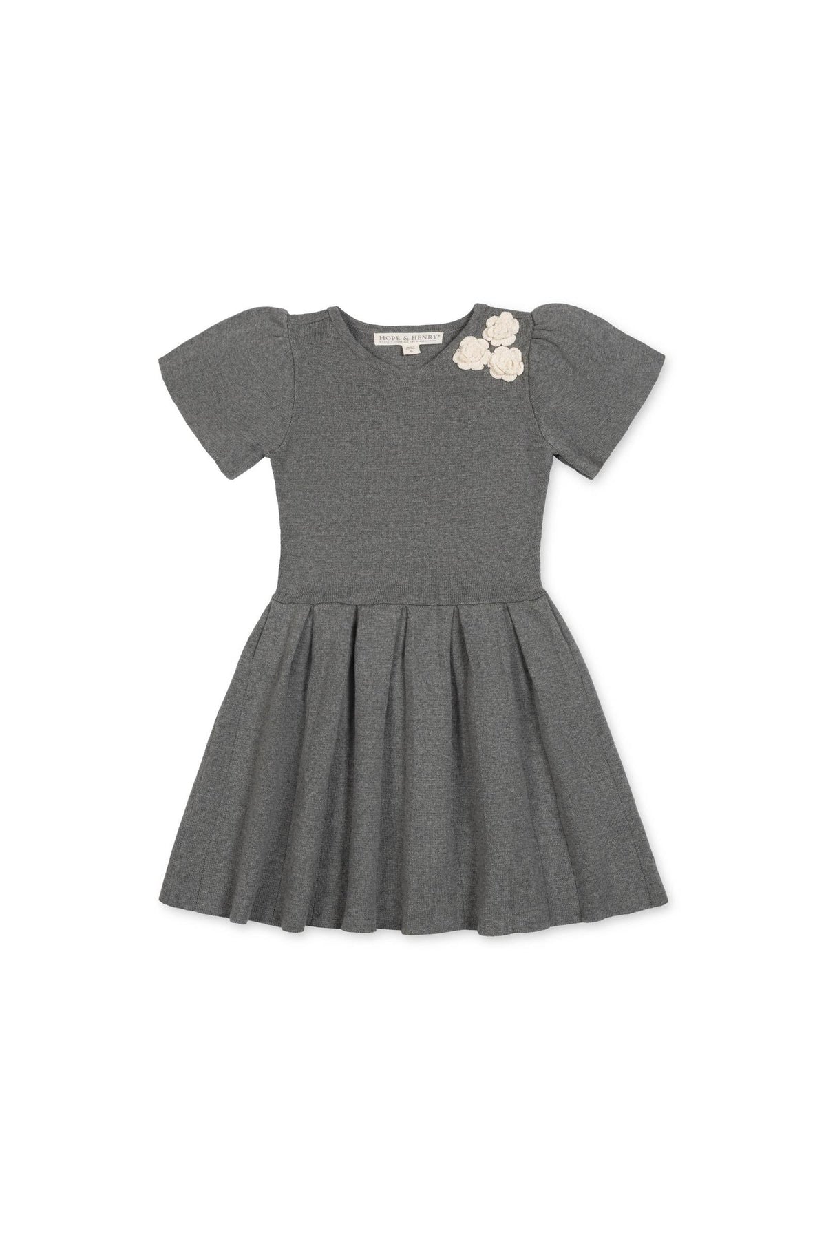 A dark gray organic cotton pleated sweater dress features short puff sleeves and decorative rosettes at the neckline, perfect for toddlers and girls who love to twirl in comfort.
