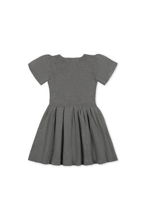 Back view of a dark gray organic cotton pleated sweater dress for toddlers and girls, featuring short puff sleeves and a flowy skirt designed for ease of movement and comfort.
