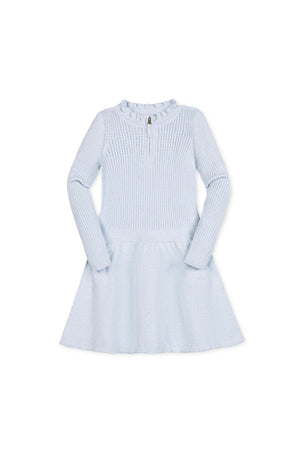 Light blue organic cotton sweater dress featuring a half zip mock neck and ruffle detailing.