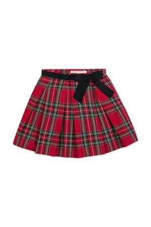 Red holiday tartan pleated skirt featuring a black waist sash and bow. Made from soft organic cotton, this stylish piece is perfect for toddlers and girls festive occasions.