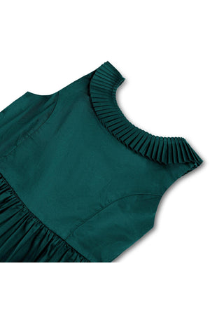 Deep green organic cotton dress featuring a pleated collar and a full skirt. Perfect for toddlers and girls, this stylish piece is ideal for holiday parties and special occasions.
