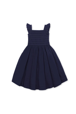 Navy organic cotton sateen party dress for toddlers and kids features a pleated bodice with knife pleated cap sleeves and a full skirt, perfect for special occasions.
