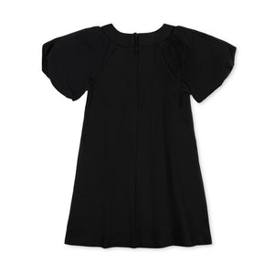 A black organic cotton dress featuring bubble sleeves and a back zipper closure. The simple swing silhouette is perfect for toddlers and kids, combining comfort with a stylish look.