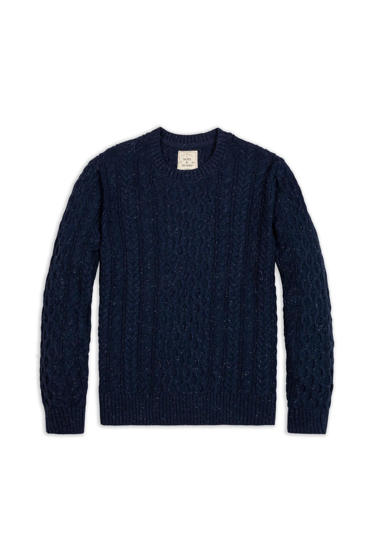 A navy organic cotton fisherman sweater features an allover cable knit design and a classic crewneck style. This sustainable pullover is perfect for cozy layering during colder seasons.