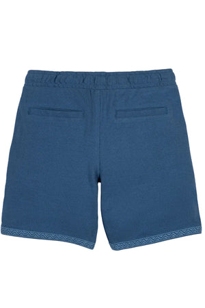 Back view of stone blue organic cotton pique pull-on shorts featuring an elastic waistband and two back pockets. Designed for comfort, these shorts are suitable for kids aged 2T-12.