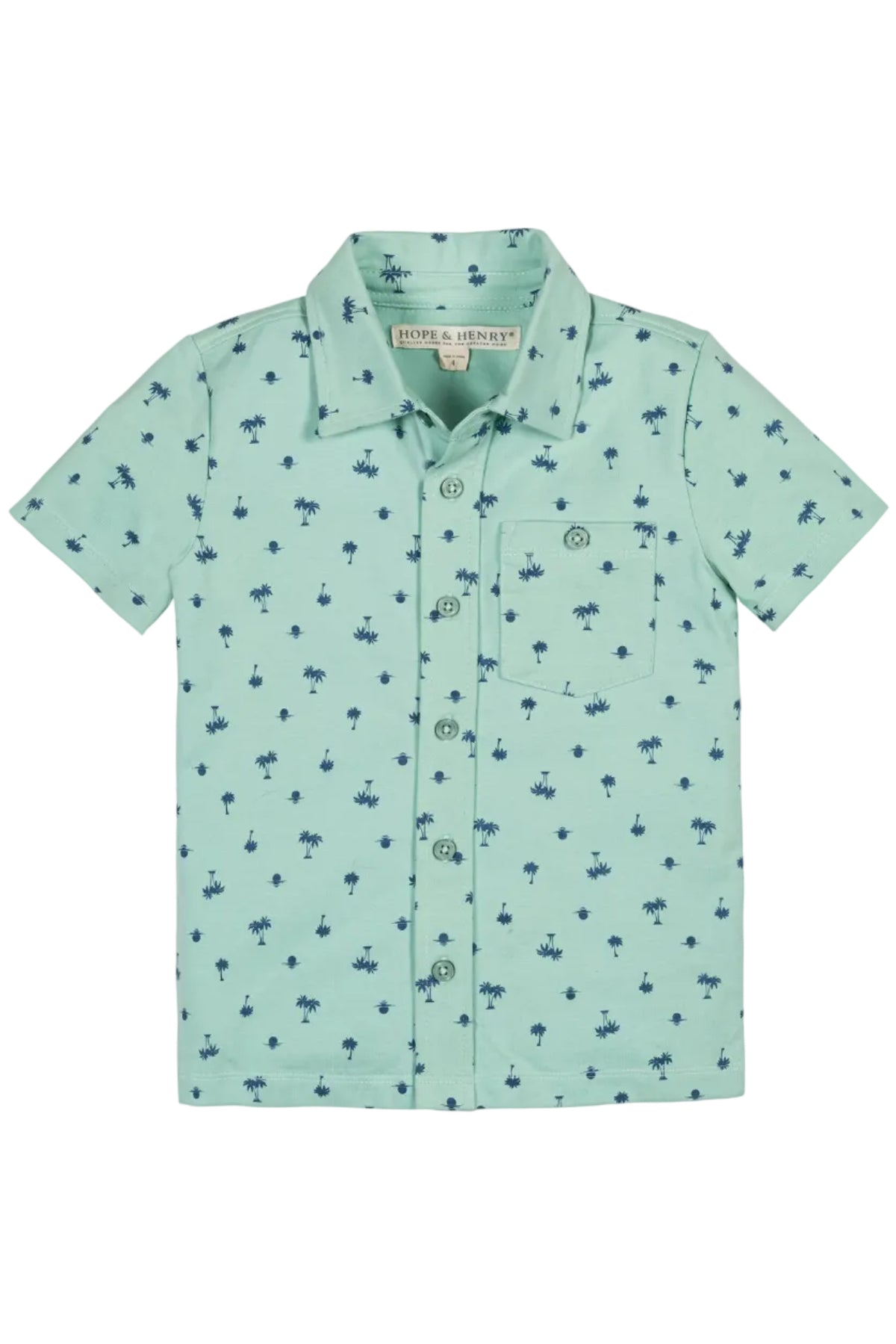 Light blue organic cotton button-down shirt featuring a playful palm tree print, designed for kids. This soft, breathable fabric is perfect for summer adventures and outdoor activities.