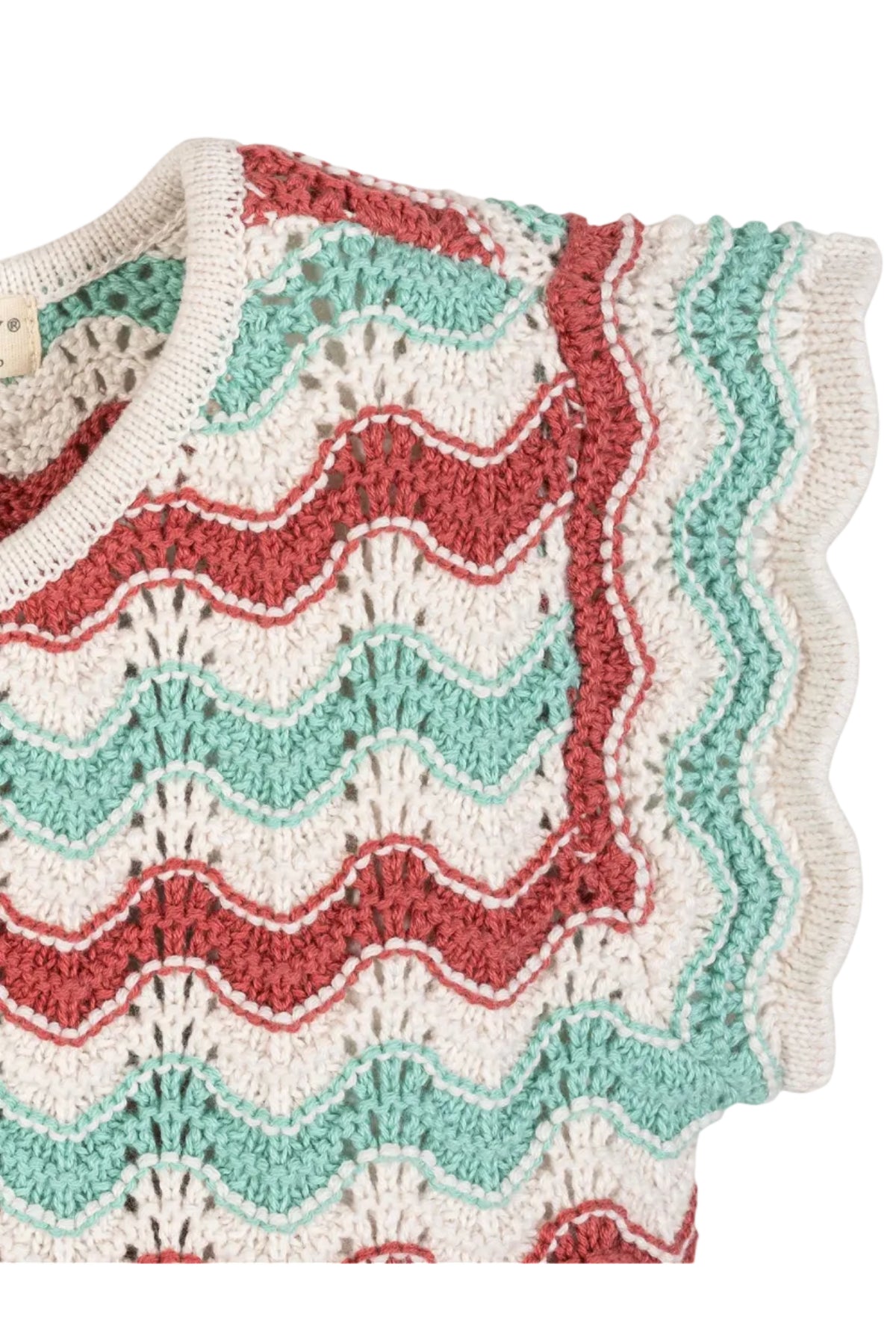 Close-up of a lightweight organic cotton sweater top featuring wavy red and teal stripes, delicate flutter sleeves, and a textured knit. Ideal for warm weather, suitable for children ages 2T-12.