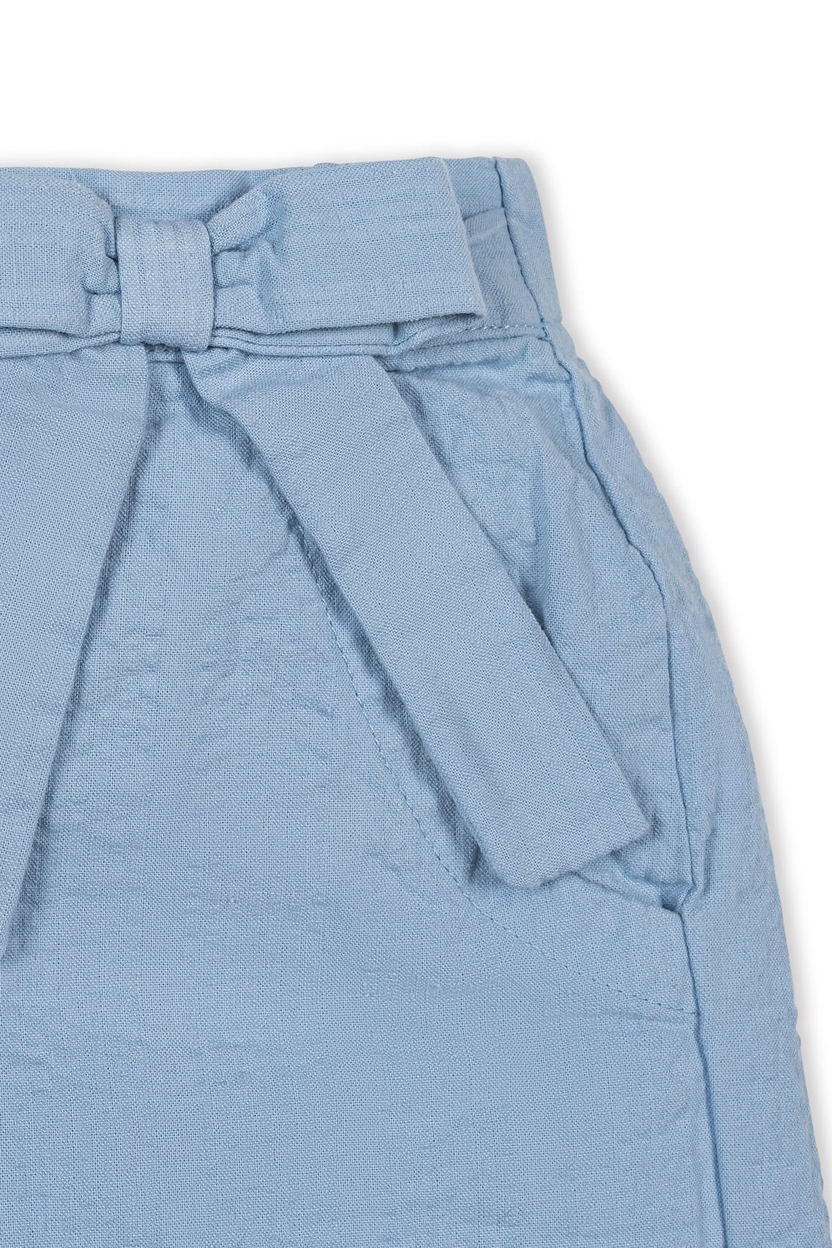 Close-up of a light blue organic cotton seersucker pull-on short featuring a decorative bow and faux belt detail. Ideal for warm weather play, suitable for children ages 2T to 12.