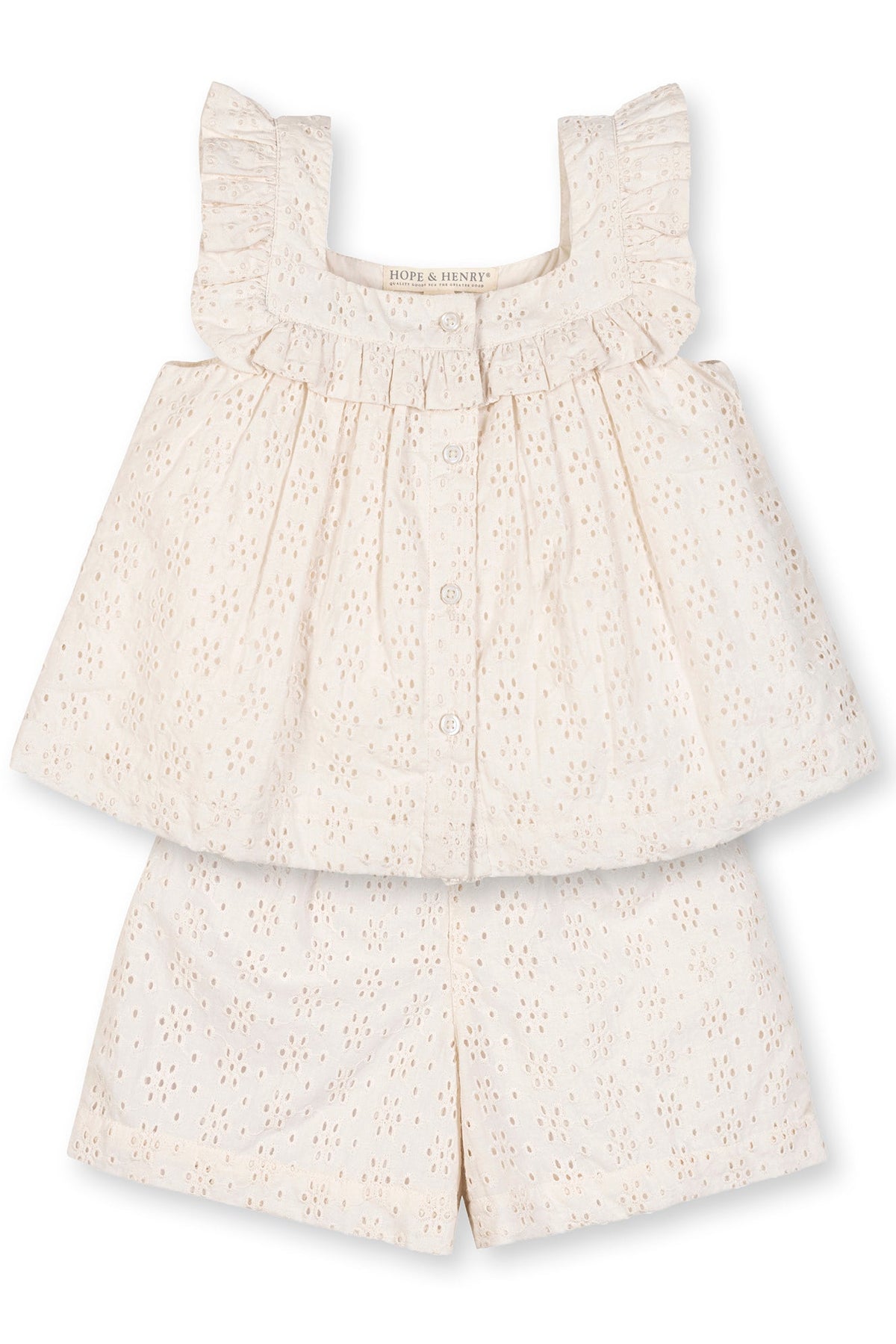 Cream-colored organic cotton tank and short set featuring eyelet detailing, ruffled edges, and a button-down front, designed for toddlers and kids for comfortable warm-weather wear.