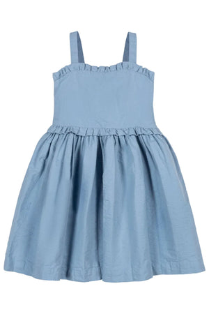 Light blue organic cotton seersucker dress featuring feminine ruffle edges and adjustable straps, perfect for summer adventures. Designed for children in sizes 2T to 12.