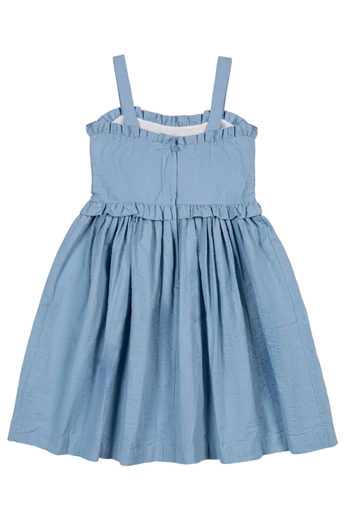 Light blue organic cotton seersucker dress featuring ruffle edges and adjustable straps. This feminine dress is perfect for summer adventures and is suitable for girls aged 2T to 12.