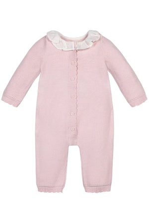 Pale pink organic cotton romper features a delicate ruffle collar and scalloped trim, designed for babies. This soft, textured knit piece is perfect for both special occasions and everyday wear.