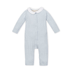 Pale blue organic cotton romper featuring a classic Peter Pan collar and cable knit texture. Designed for comfort, this timeless piece is perfect for everyday wear on delicate baby skin.