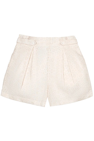 Light cream organic cotton shorts featuring eyelet details, a cinched waist with button tabs, and side pockets. Ideal for warm weather, these stylish shorts offer comfort and sustainability.