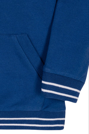 A close-up view of a blue organic cotton hoodie featuring a kanga pocket and striped ribbed cuffs. The soft French terry fabric suggests comfort for kids aged 2T to 18.