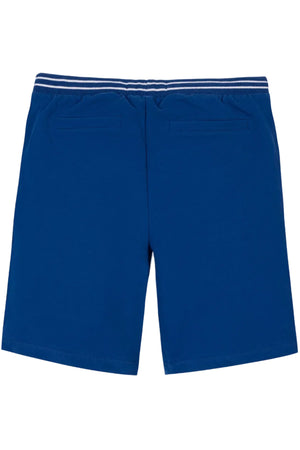 Back view of blue organic cotton French terry pull-on shorts featuring an elastic waistband and two back pockets. Designed for comfort, these shorts are ideal for active kids aged 4T-14.