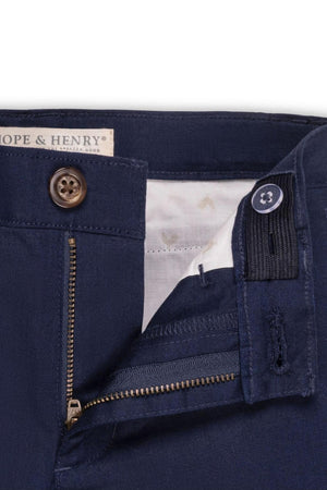 Close-up view of Hope & Henrys navy linen suit pant for baby boys, featuring a zip fly, faux tortoiseshell button, and adjustable waistband, showcasing its quality and style.