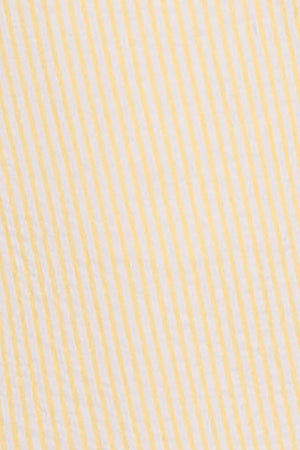 Close-up of a yellow seersucker fabric, featuring alternating thin white and yellow stripes, showcasing a textured finish.