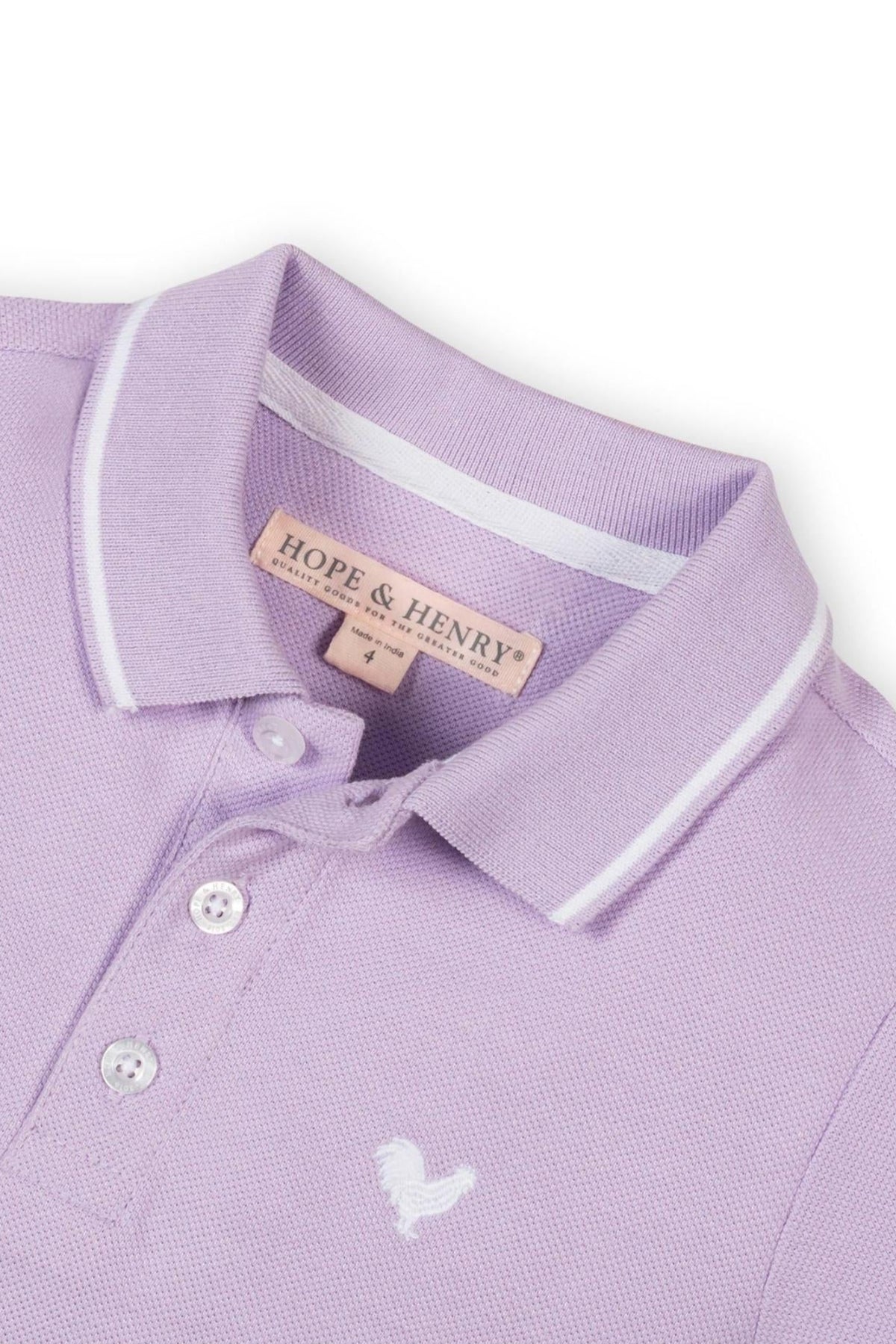 A close-up of a lavender polo shirt by Hope & Henry, featuring a flat-knit collar and an embroidered logo.