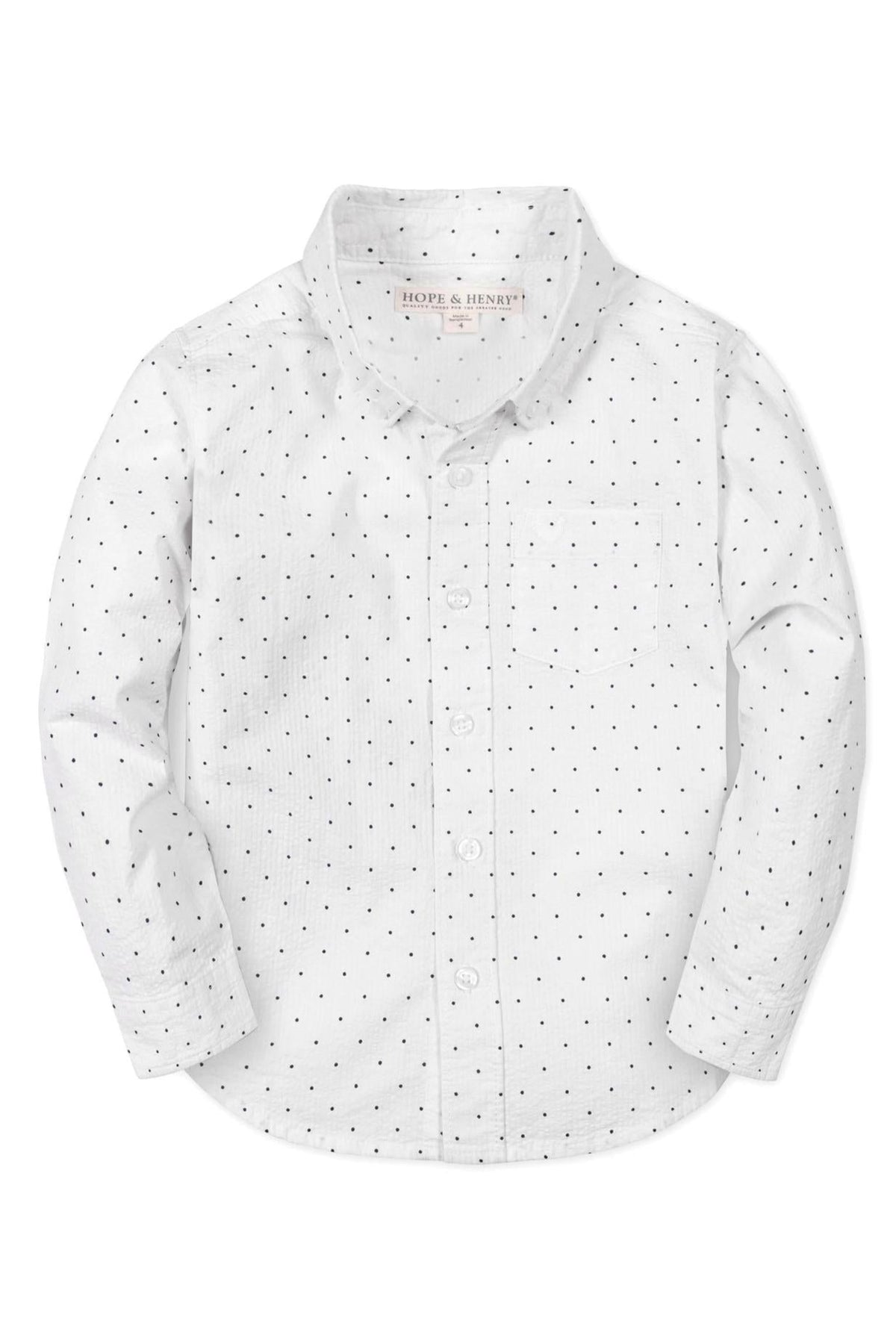White long-sleeve button-down shirt by Hope & Henry, featuring black polka dots and a chest pocket, made from organic cotton.