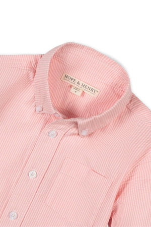 Close-up of a pink striped button-down shirt by Hope & Henry, featuring a collar and a chest pocket.