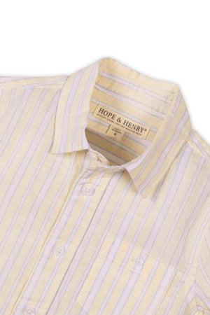 A close-up view of a Hope & Henry short sleeve shirt featuring a sunlit stripe pattern in soft yellow and white hues, made from lightweight linen for boys aged 2T-18.