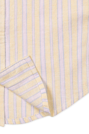 Close-up of a Hope & Henry short sleeve shirt, featuring sunlit yellow and lavender stripes. The fabric appears lightweight, perfect for warm weather, with a neatly stitched hem and collar.