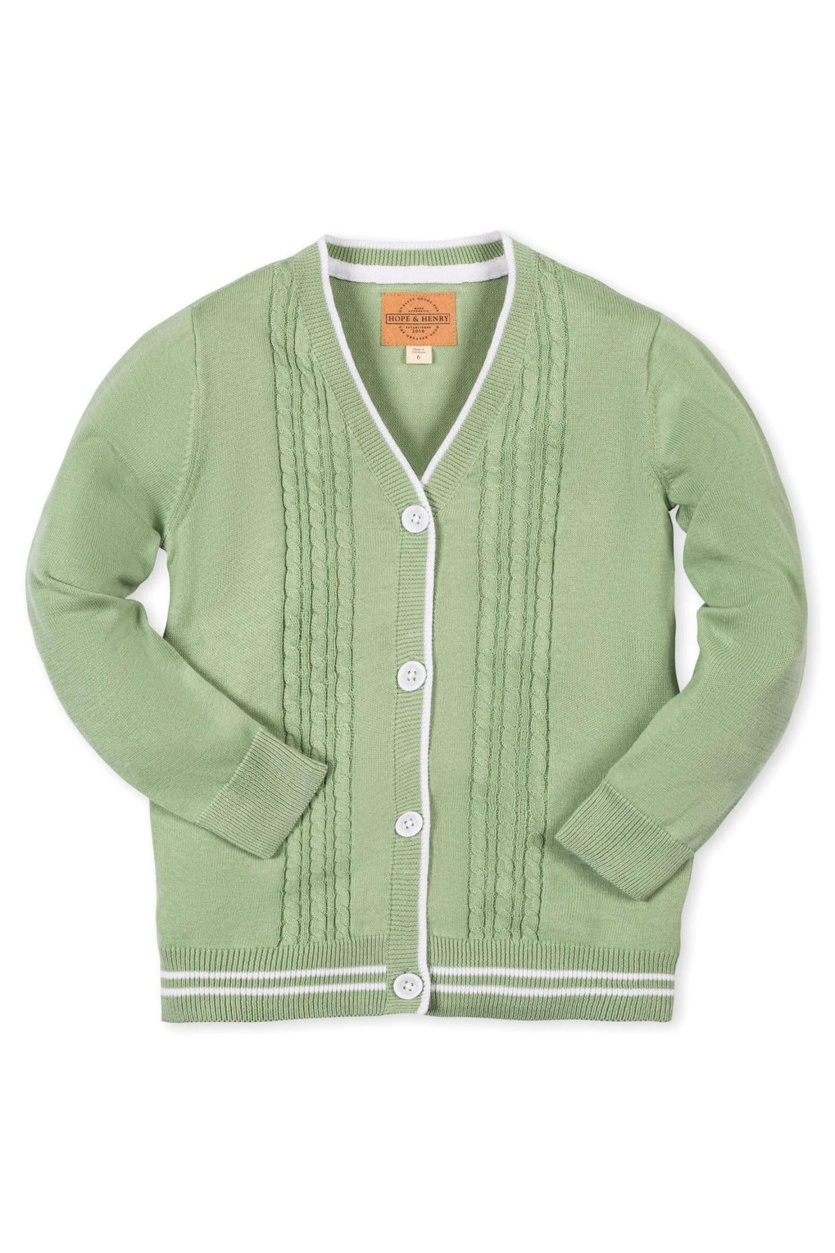 Soft green cable knit cardigan featuring a v-neck, white striped trim, and faux horn buttons, made from organic cotton.