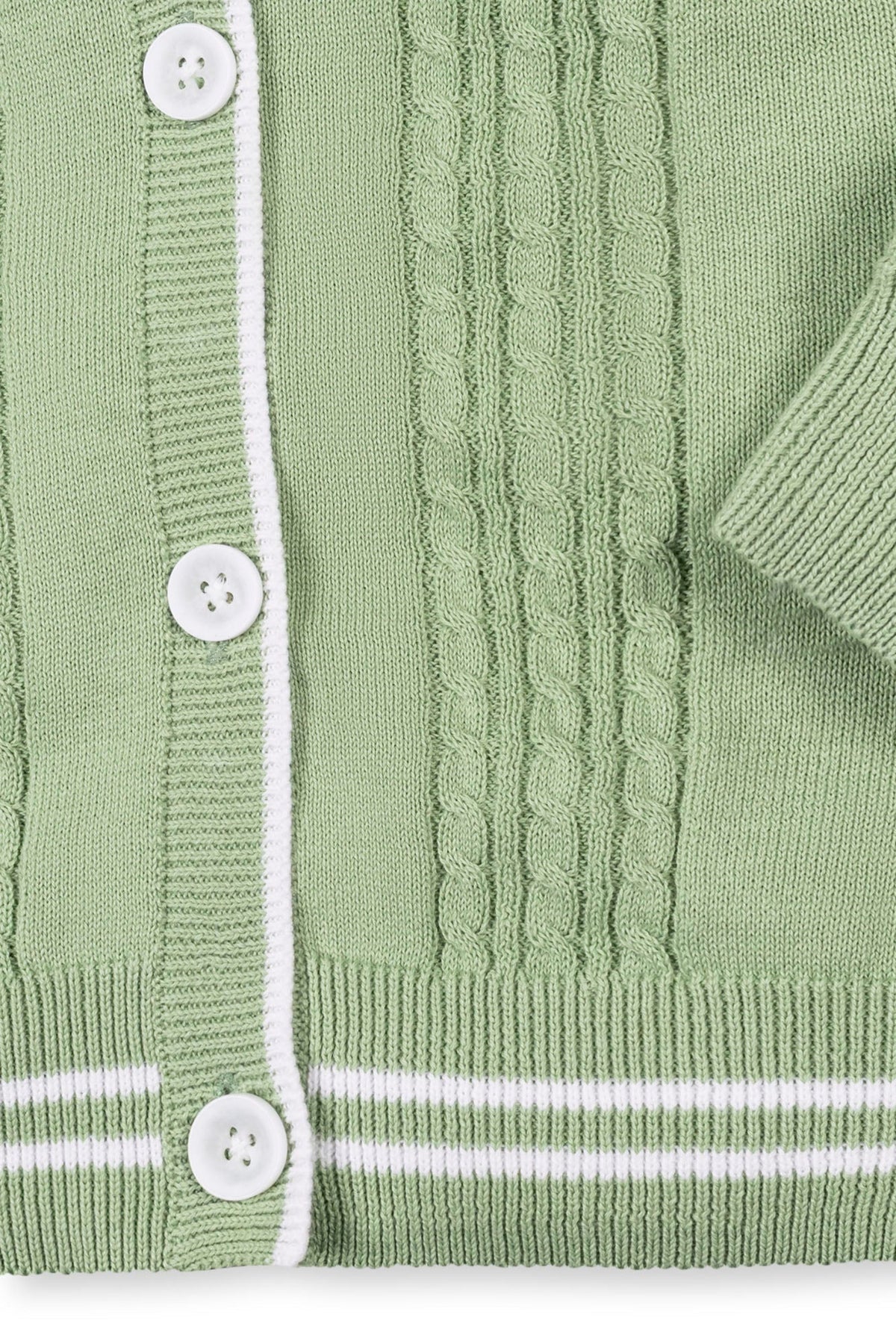 Soft green cable knit cardigan featuring a white striped rib trim and faux horn buttons, made from organic cotton.