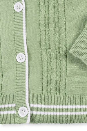 Soft green cable knit cardigan featuring a white striped rib trim and faux horn buttons, made from organic cotton.