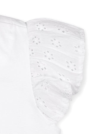 Close-up of a white top showcasing soft organic cotton fabric with delicate eyelet flutter sleeves, perfect for toddlers and kids.