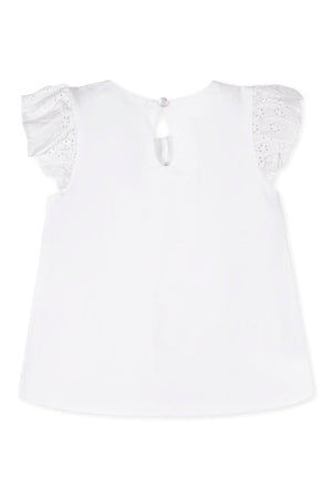 Back view of a white organic cotton top featuring delicate eyelet flutter sleeves and a keyhole button closure.