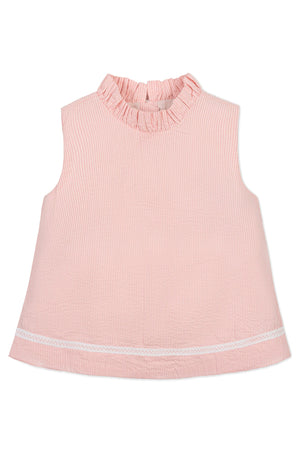 A sleeveless pink seersucker top with a ruffle collar and lace trim at the hem, suitable for girls.