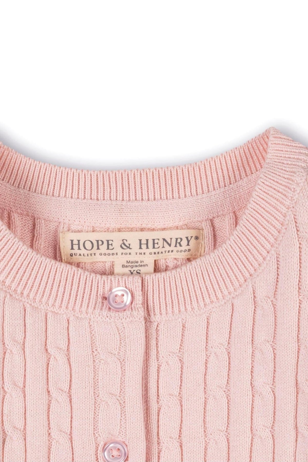 Close-up of a pink cable knit cardigan by Hope & Henry, featuring a round neckline and a pink button closure.