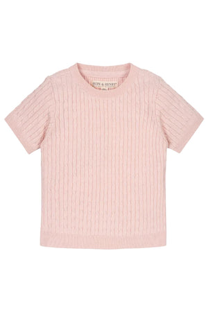 A soft pink short sleeve cable sweater from Hope & Henry, made from 100% organic cotton. It features an allover cable knit design, perfect for girls aged 2T-12.