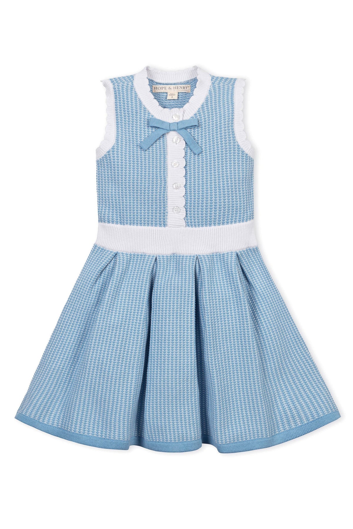 Blue and white sleeveless dress with button front, scalloped edges, and a bow at the neckline.
