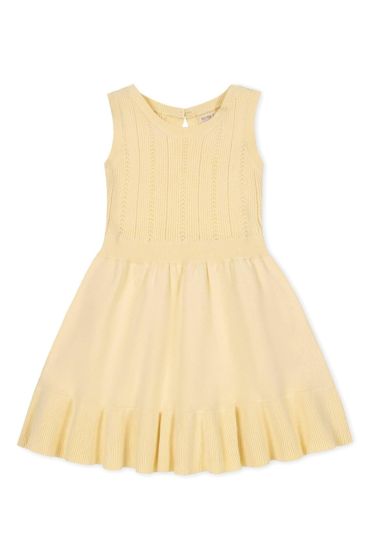 Yellow tank sweater dress with a flounce hem and textured bodice, made of organic cotton.