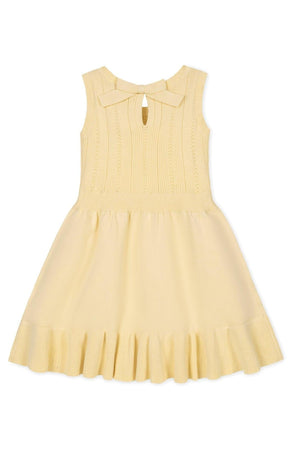 Yellow organic cotton tank sweater dress with a flounce hem and back bow detail, suitable for girls.